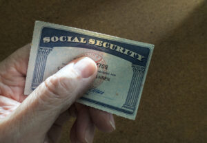 a photo of a social security card with the number and name hidden