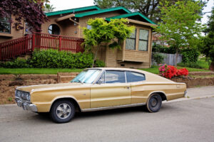 a gold colored vintage dodge Charger