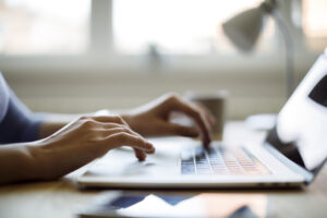 a woman using her laptop while working from home